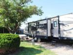 RV parked near tree at WHIP IN RV PARK - thumbnail