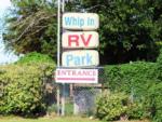 Campground signs near entrance at WHIP IN RV PARK - thumbnail
