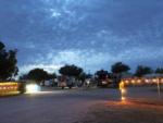 Campground and RVs at night with lights at WHIP IN RV PARK - thumbnail