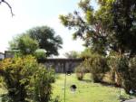 Yard with lawn and trees at WHIP IN RV PARK - thumbnail