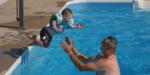 A child jumping into the pool - thumbnail