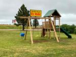 Wooden play structure at the playground at BLACK HILLS RV PARK - thumbnail