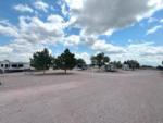 Fluffy clouds and blue sky over the park at BLACK HILLS RV PARK - thumbnail