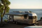 Airstream parked in a site by the ocean - thumbnail