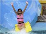 View larger image of A girl going down a waterslide at LAND-O-PINES FAMILY CAMPGROUND image #1