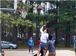Young men playing basketball at BUFFALO LAKE CAMPING RESORT - thumbnail