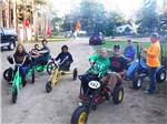 Kids riding on pedal karts at BUFFALO LAKE CAMPING RESORT - thumbnail