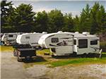 A row of trailers in grassy sites at RAYPORT CAMPGROUND - thumbnail