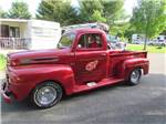 View larger image of An old red truck driving around at RED APPLE CAMPGROUND image #4
