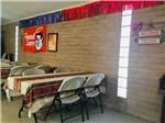 View larger image of Tables and chairs inside the rec room at MISSION RV PARK image #12