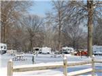 RVs and trailers camping in the snow at HUNTINGTON FOX FIRE KOA - thumbnail