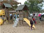 Kids playing on the playground equipment at HUNTINGTON FOX FIRE KOA - thumbnail