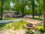 Open RV space with fire pit at The Broken Banjo RV Park - thumbnail