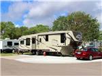 View larger image of A 5th wheel trailer in an RV site at COLONIA DEL REY RV PARK image #2