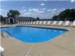The swimming pool with white lounge chairs at MERAMEC CAMPGROUND - thumbnail