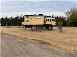 View larger image of A search and rescue tank parked in a grassy site at HIGH PLAINS CAMPING image #5