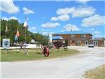 Park entrance with view of office and store at CAMPER'S PARADISE RV PARK - thumbnail