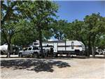 A travel trailer in an RV site at CAMPER'S PARADISE RV PARK - thumbnail