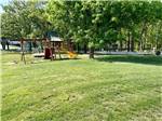 The grassy playground area at OSAGE BEACH RV PARK - thumbnail