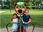 Two kids with Yogi the Bear at FRANKENMUTH YOGI BEAR'S JELLYSTONE PARK CAMP-RESORT - thumbnail