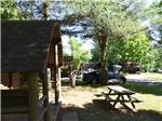 A row of rustic cabins at GREAT CANADIAN RESORTS & CAMPGROUNDS - thumbnail