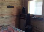 The microwave and refrigerator in the rental cabin at CEDAR BREAKS RV PARK - thumbnail