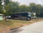 Large RV in site at PIONEER VILLAGE CAMPGROUND - thumbnail