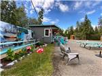 View larger image of Raised wooden patio with chairs and railing at CARIBOU RV PARK image #4