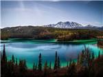 View larger image of Emerald lake with mountains in background at CARIBOU RV PARK image #6