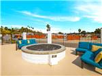 A large swimming pool with lounge chairs at OCEANSIDE RV RESORT - thumbnail