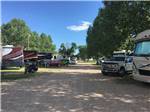 Gravel road with gravel RV sites at AB CAMPING RV PARK - thumbnail