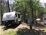 A travel trailer in a dirt RV site at PARADISE LAKE AND CAMPGROUND - thumbnail