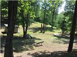 A playground area with a park bench at PARADISE LAKE AND CAMPGROUND - thumbnail