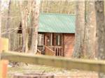 One of the rental log cabins at PARADISE LAKE AND CAMPGROUND - thumbnail