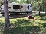View larger image of Row of big rig RVs in gravel sites at PARADISE LAKE FAMILY CAMPGROUND image #5