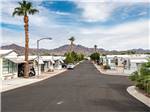 A paved road between the mobile homes at SUNDANCE RV RESORT - thumbnail