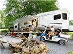People talking at an RV campsite at HICKORY RUN CAMPGROUND - thumbnail
