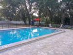 Fenced in swimming pool at HAPPY TRAVELER RV RESORT - thumbnail