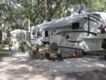 Parked RV with deck at HAPPY TRAVELER RV RESORT - thumbnail