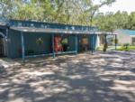 A soda vending machine in front of the building at HAPPY TRAVELER RV RESORT - thumbnail