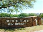 View larger image of The stone wall entrance sign at SOUTHERN AIRE RV RESORT image #4