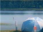 A tent site by the water at HARTT ISLAND RV RESORT & WATERPARK - thumbnail