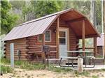One of the rustic rental log cabins at BRYCE-ZION CAMPGROUND - thumbnail