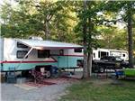 A fifth wheel trailer in a gravel spot at BEAN POT CAMPGROUND - thumbnail