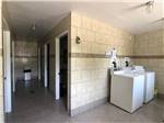 View larger image of Inside of the laundry room and shower stalls at CAMPING DU VIEUX MOULIN image #6
