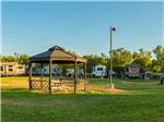 View larger image of Gazebo centered in grassy area at VINEYARD RV PARK image #8