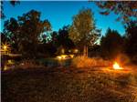 View larger image of Night view of fountain on the water and blazing fire pit at VINEYARD RV PARK image #9
