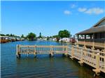View larger image of The pier on the water at SUNDANCE LAKES RV RESORT image #5