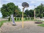 The kids play area and basketball court at LOUISVILLE NORTH CAMPGROUND - thumbnail