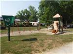 The playground with swings and play structure - thumbnail